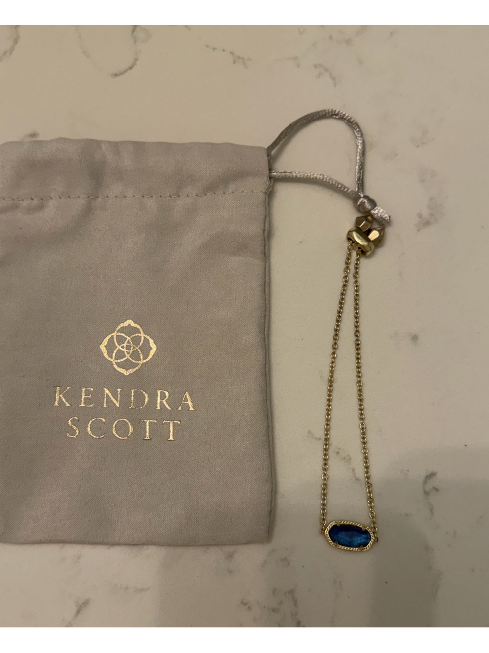Kendra Scott Gold Bracelet with Royal Blue Stone